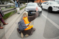 Activists Block Highway By Glueing Their Hands In Warsaw