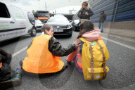 Activists Block Highway By Glueing Their Hands In Warsaw
