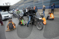 Activists Block Highway By Glueing Their Hands In Warsaw