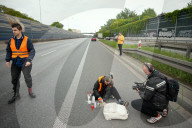 Activists Block Highway By Glueing Their Hands In Warsaw