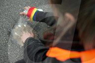 Activists Block Highway By Glueing Their Hands In Warsaw