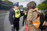Activists Block Highway By Glueing Their Hands In Warsaw