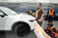 Activists Block Highway By Glueing Their Hands In Warsaw