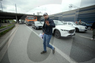 Activists Block Highway By Glueing Their Hands In Warsaw