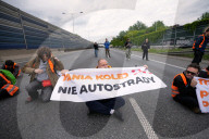 Activists Block Highway By Glueing Their Hands In Warsaw