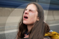 Activists Block Highway By Glueing Their Hands In Warsaw