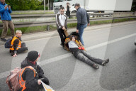 Activists Block Highway By Glueing Their Hands In Warsaw