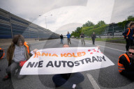 Activists Block Highway By Glueing Their Hands In Warsaw
