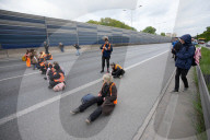 Activists Block Highway By Glueing Their Hands In Warsaw