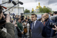 Ukrainian President Volodymyr Zelensky, French President Emmanuel Macron, And UK Prime Minister Keir Starmer Lay Flowers At The Wall Of Remembrance For Fallen Ukrainian Soldiers In Kyiv