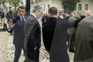 Ukrainian President Volodymyr Zelensky, French President Emmanuel Macron, And UK Prime Minister Keir Starmer Lay Flowers At The Wall Of Remembrance For Fallen Ukrainian Soldiers In Kyiv