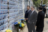 Ukrainian President Volodymyr Zelensky, French President Emmanuel Macron, And UK Prime Minister Keir Starmer Lay Flowers At The Wall Of Remembrance For Fallen Ukrainian Soldiers In Kyiv
