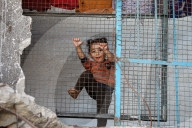 Displaced Gazans take refuge in tents and damaged schools