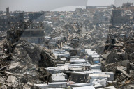 Displaced Gazans take refuge in tents and damaged schools