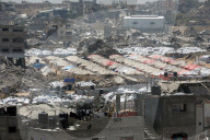 Displaced Gazans take refuge in tents and damaged schools