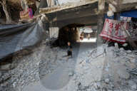Displaced Gazans take refuge in tents and damaged schools