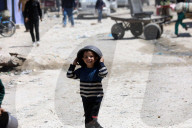 Displaced Gazans take refuge in tents and damaged schools