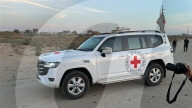Red Cross vehicles carrying Israeli American hostage Idan Alexander at border crossing