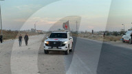 Red Cross vehicles carrying Israeli American hostage Idan Alexander at border crossing