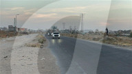 Red Cross vehicles carrying Israeli American hostage Idan Alexander at border crossing