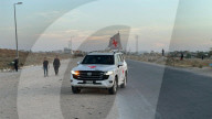 Red Cross vehicles carrying Israeli American hostage Idan Alexander at border crossing