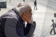 Elderly Man Alone In Public Space