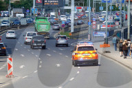 Emergency Vehicle With Flashing Lights In Prague City Traffic