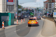 Emergency Vehicle With Flashing Lights In Prague City Traffic