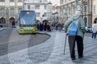 Senior Citizen Walking With Cane In Central Prague