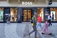 Hugo Boss Storefront With Passersby In Prague