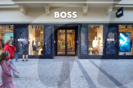 Hugo Boss Storefront With Passersby In Prague