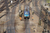 Railway Workers On Tracks By Prague Central Station