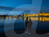 Daily Life By The Riverbank At Vltava River In Prague At Night