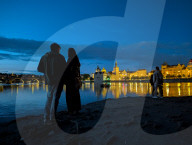 Daily Life By The Riverbank At Vltava River In Prague At Night