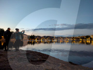 Daily Life By The Riverbank At Vltava River In Prague At Night