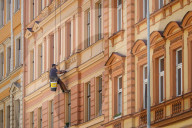 Facade Maintenance Worker On Historical Building