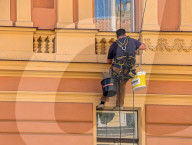 Facade Maintenance Worker On Historical Building