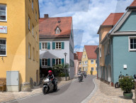 Motorcyclists Passing Through Residential Area