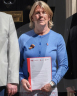 Victims of UK's infected blood scandal demand compensation