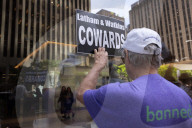 Demonstrators Protest Law Firms That Cut Deals With Trump