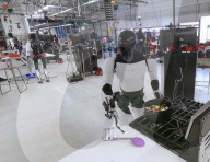 Tesla robots being trained in. household chores