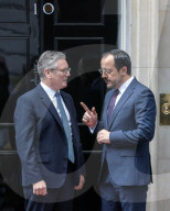 Ministers arrive in Downing Street in London, UK.