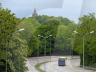 Expressbus X204 On Curved Road Near Forest In Munich