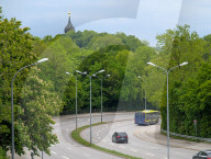 Expressbus X204 On Curved Road Near Forest In Munich