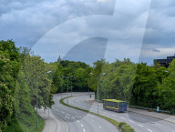 Expressbus X204 On Curved Road Near Forest In Munich