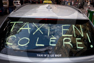 French Taxi Drivers Block Paris Street to Protest Health Transport Pricing Plan