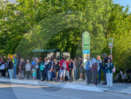 Tourists Waiting At Bus Stop In Garmisch-Partenkirchen