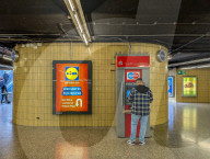 Man Using ATM In Munich Subway Station