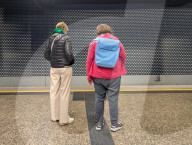 Two Women Waiting At Train Platform