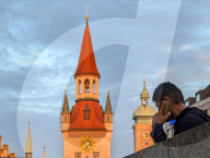 Marienplatz Towers And Phone Call At Sunset In Munich